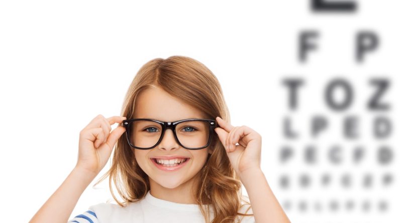 smiling cute little girl with black eyeglasses